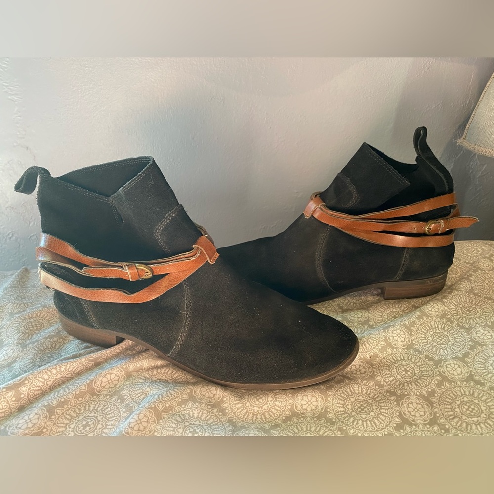 - Leather boots. Black suede with brown leather decorative straps.
